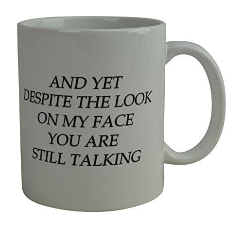 Taza para café con texto jocoso en inglés “And Yet Despite the Look on My Face You Are Still Talking” 11 onzas. Apta para microonda - Imagen 3